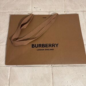 BURBERRY brown paper bag w/handles, 16.5” by 11.75”